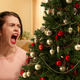 Illustration for article titled ‘Bring Me Some Holiday Cheer, You Son Of A Bitch’ Says Woman Slamming Christmas Tree Up Against Wall